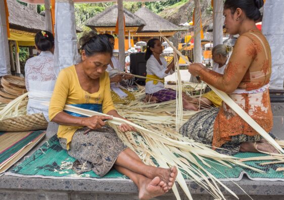 Sulawesi Island, Indonesia - August, 15 2015: Asian women working with dried leaves