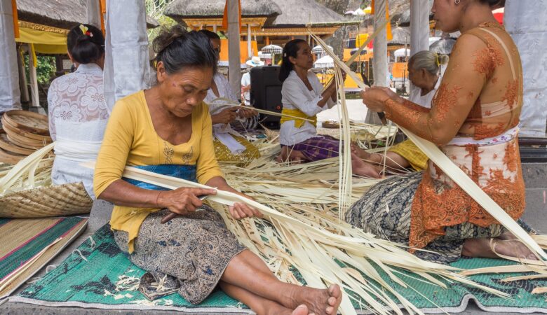Sulawesi Island, Indonesia - August, 15 2015: Asian women working with dried leaves