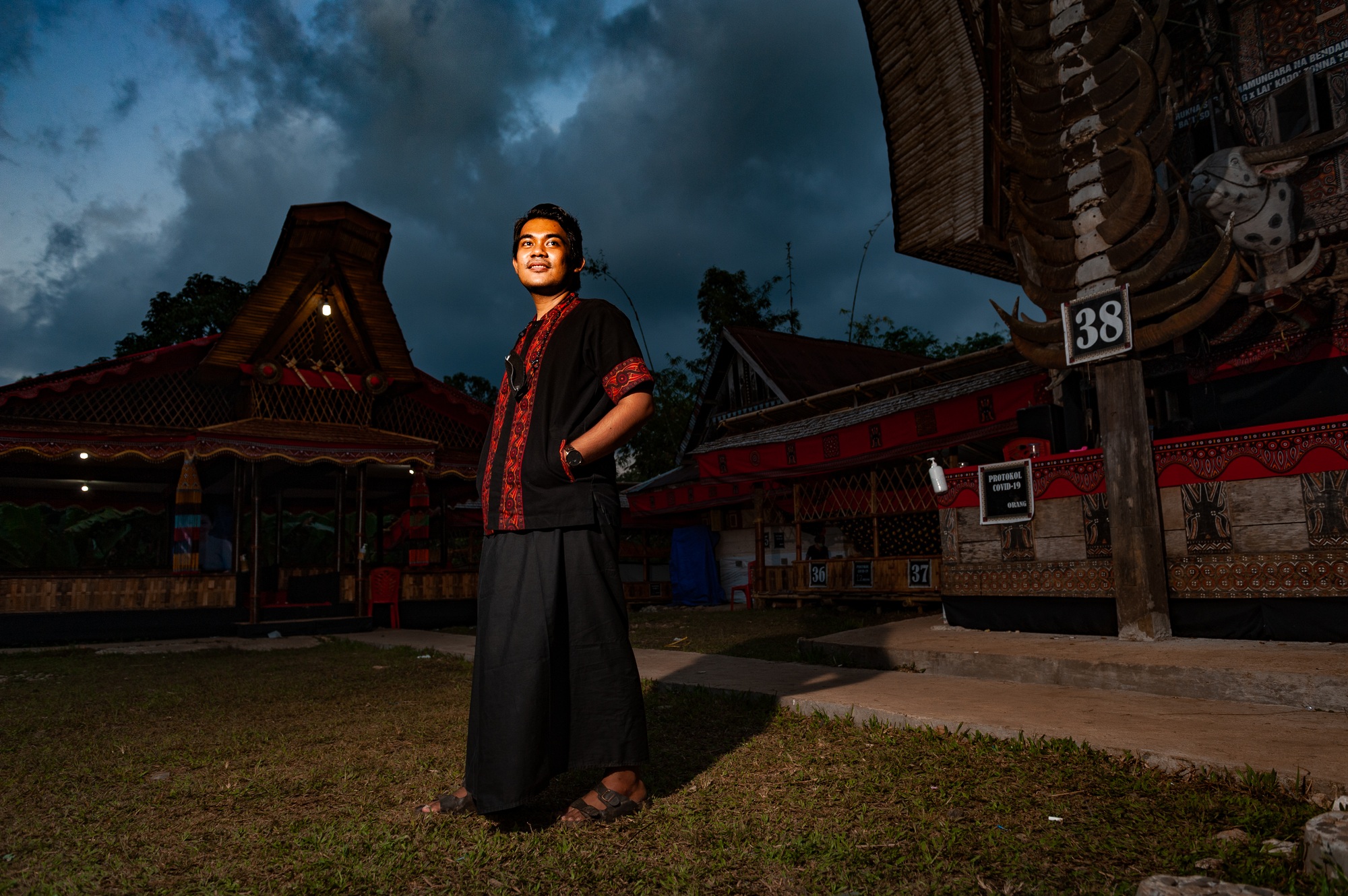 Young man standing outdoor in tana toraja in sulawesi island, in